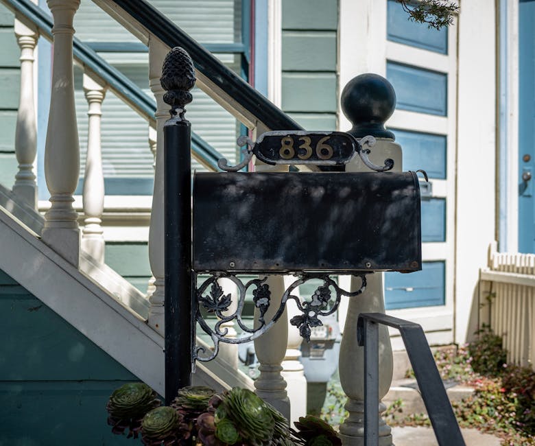 A vintage mailbox at house number 836 with a charming staircase.